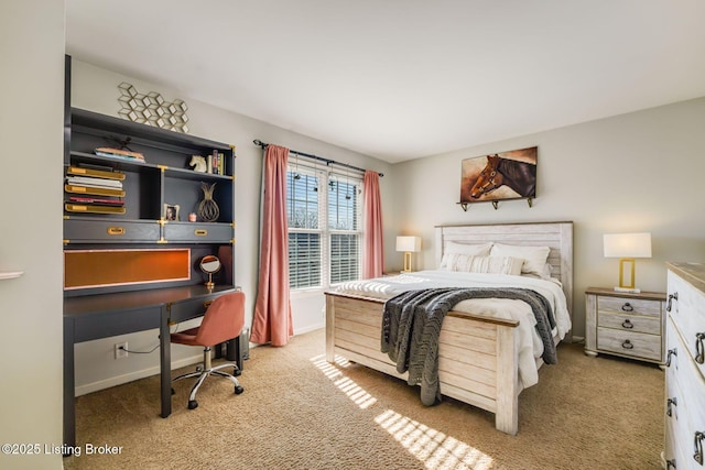 carpeted bedroom featuring baseboards