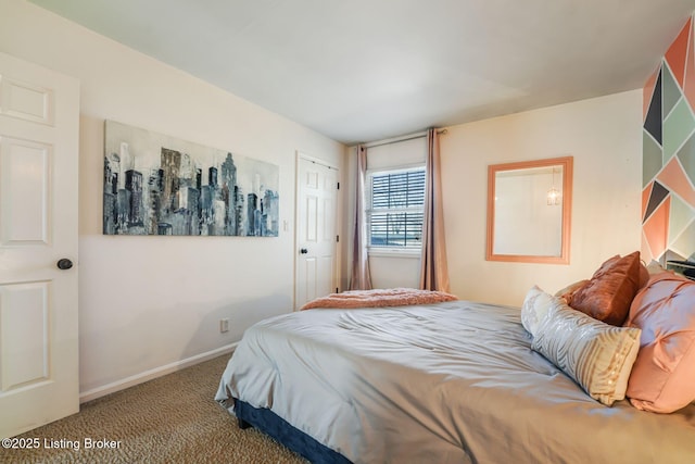 bedroom with carpet floors and baseboards