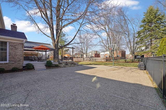 view of yard with fence and a wooden deck