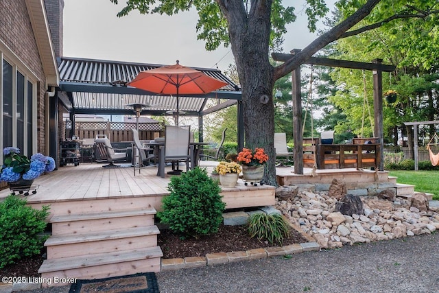 deck featuring outdoor dining area