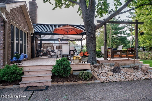 deck featuring outdoor dining area