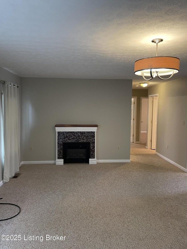 unfurnished living room featuring visible vents, baseboards, and light colored carpet