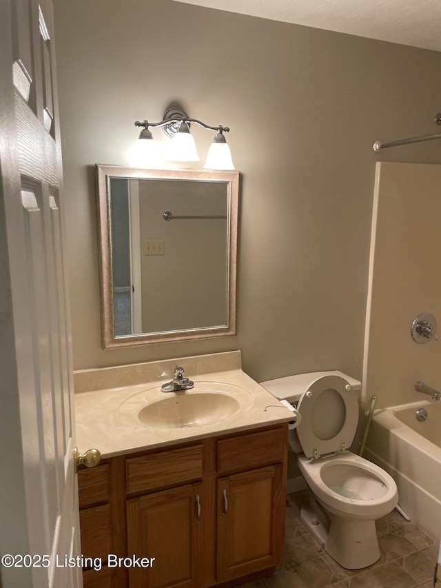 bathroom with tile patterned flooring, vanity, toilet, and bathing tub / shower combination