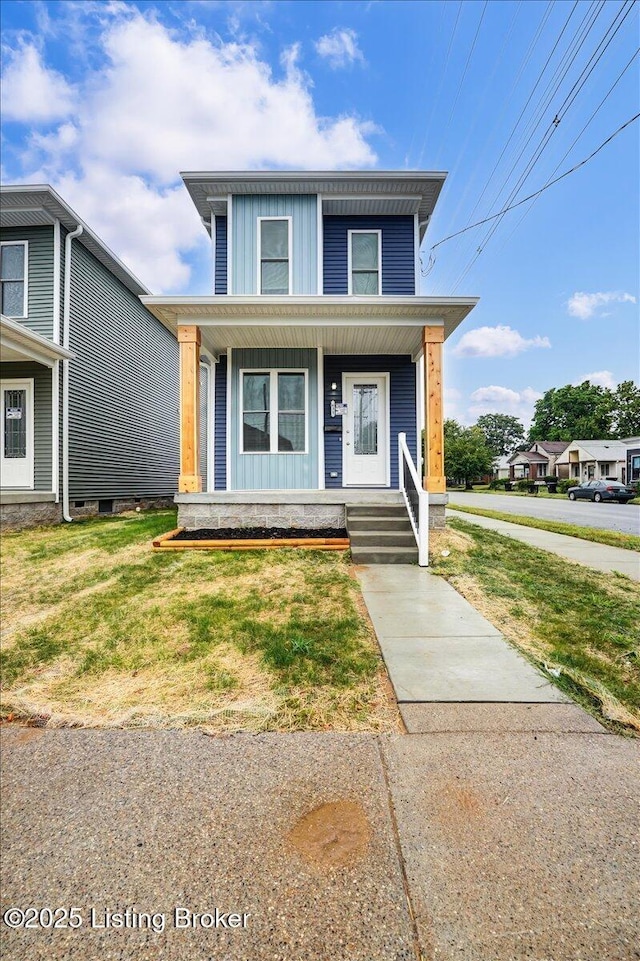 view of front of property featuring covered porch, a front lawn, and board and batten siding