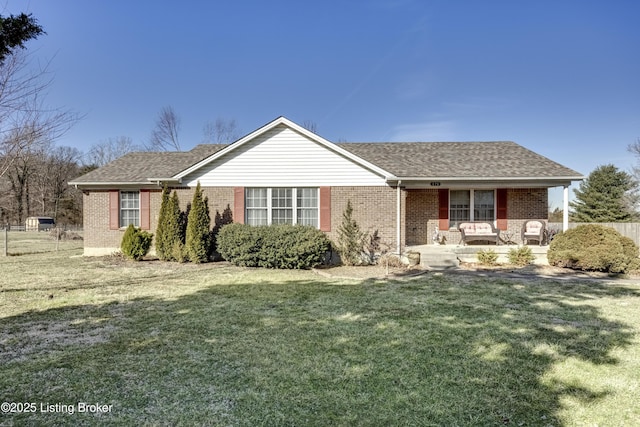 single story home with roof with shingles, brick siding, a front lawn, and a porch