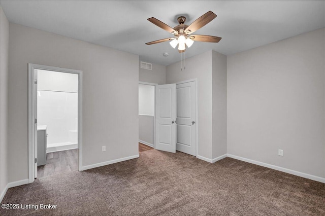 unfurnished bedroom featuring carpet, visible vents, ceiling fan, and baseboards