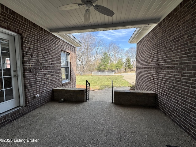 view of patio / terrace featuring ceiling fan and fence