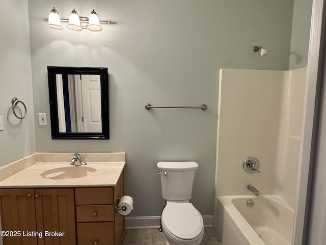 full bath with vanity, baseboards, shower / washtub combination, tile patterned floors, and toilet