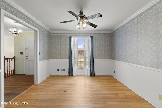 3004 Brownsboro Vista Dr, Louisville, KY 40242 - empty room with wood finished floors, visible vents, a wainscoted wall, wallpapered walls, and ornamental molding
