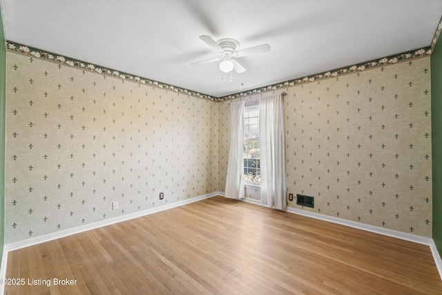 3004 Brownsboro Vista Dr, Louisville, KY 40242 - empty room with wallpapered walls, visible vents, light wood finished floors, and ceiling fan