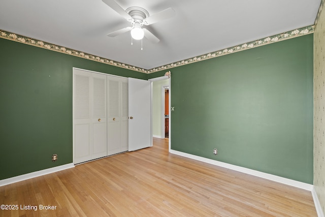 3004 Brownsboro Vista Dr, Louisville, KY 40242 - unfurnished bedroom featuring a closet, ceiling fan, baseboards, and wood finished floors