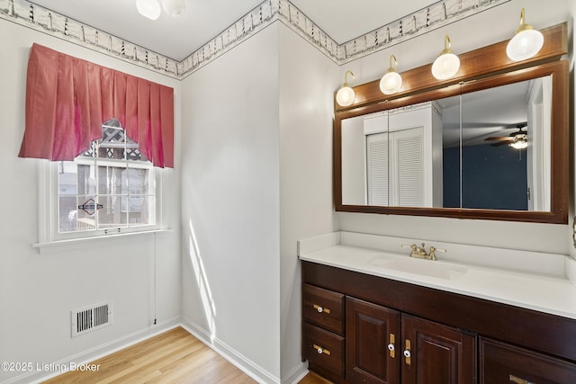 3004 Brownsboro Vista Dr, Louisville, KY 40242 - bathroom with visible vents, ceiling fan, baseboards, wood finished floors, and vanity