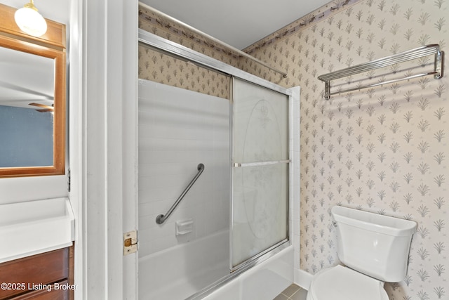 3004 Brownsboro Vista Dr, Louisville, KY 40242 - bathroom featuring wallpapered walls, toilet, vanity, and bath / shower combo with glass door