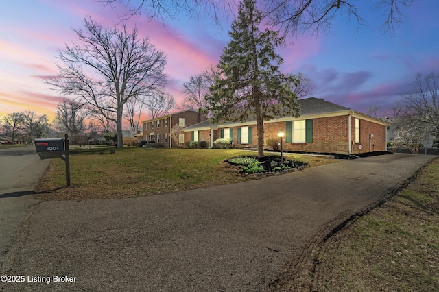 3004 Brownsboro Vista Dr, Louisville, KY 40242 - view of front of home with aphalt driveway, brick siding, and a yard