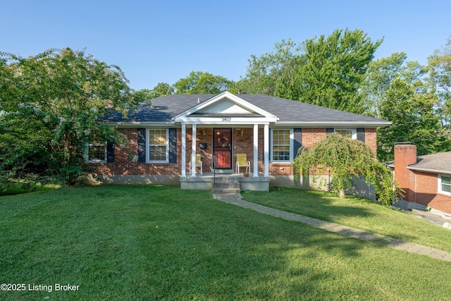 view of front facade featuring a front lawn and brick siding