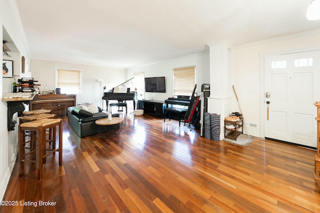 living room featuring ornamental molding and hardwood / wood-style flooring