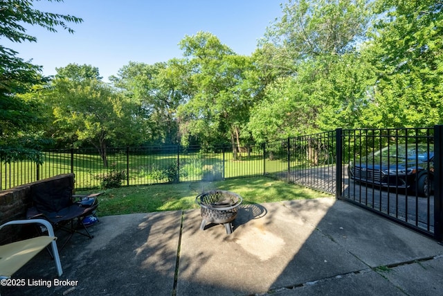 view of patio / terrace with fence and a fire pit