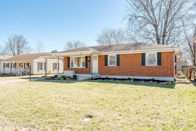 ranch-style home with a front lawn and brick siding