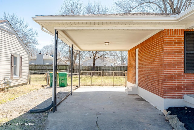 view of patio / terrace featuring a carport and fence