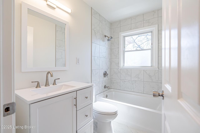 bathroom featuring shower / bathtub combination, marble finish floor, vanity, and toilet