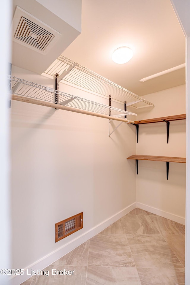 walk in closet featuring visible vents