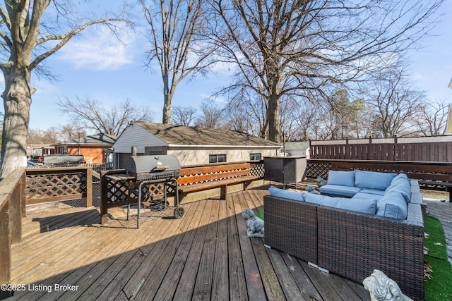 deck featuring an outdoor hangout area, grilling area, and fence