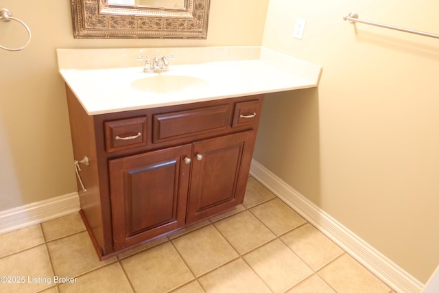 bathroom with tile patterned flooring, vanity, and baseboards