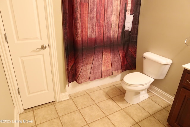 full bath with toilet, baseboards, vanity, and tile patterned floors