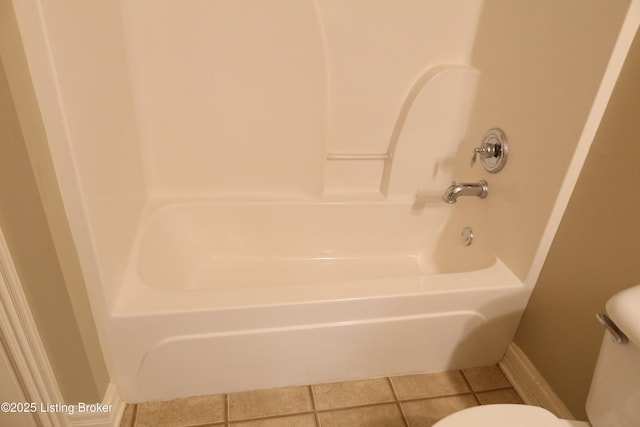 bathroom with  shower combination, baseboards, toilet, and tile patterned floors