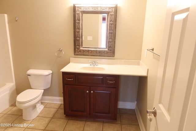 full bathroom featuring baseboards, vanity, toilet, and tile patterned floors