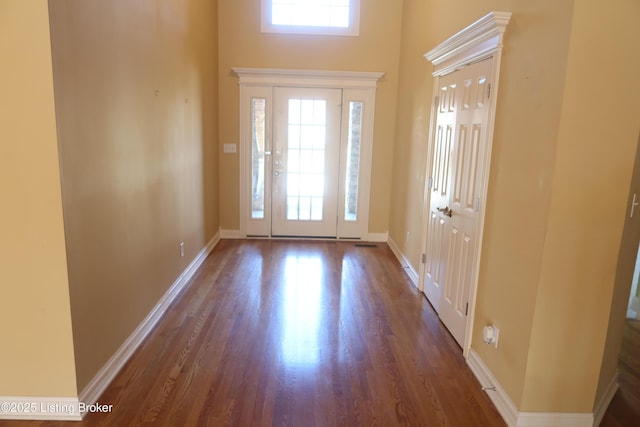 entrance foyer featuring plenty of natural light, wood finished floors, and baseboards