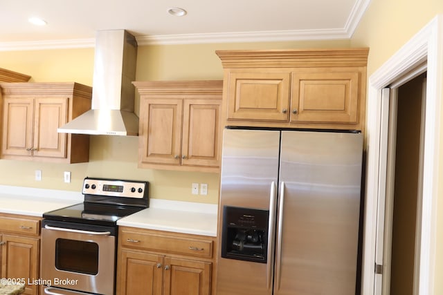 kitchen with appliances with stainless steel finishes, ornamental molding, and wall chimney range hood