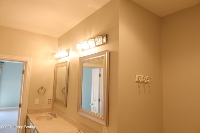 bathroom featuring double vanity and a sink