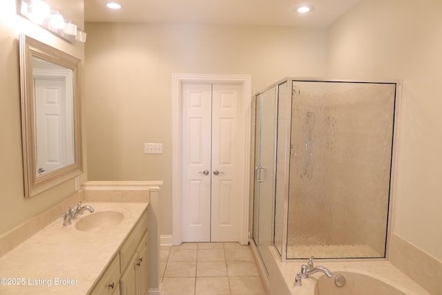 bathroom with a garden tub, recessed lighting, a stall shower, vanity, and tile patterned floors