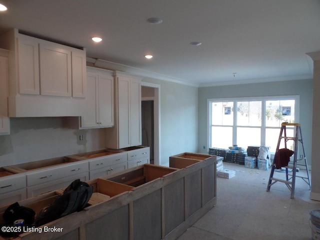 kitchen with recessed lighting, white cabinetry, crown molding, and black electric stovetop