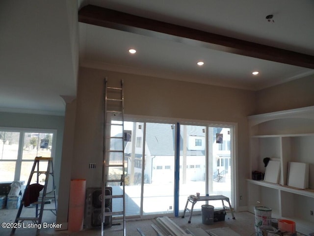 living area with recessed lighting and crown molding