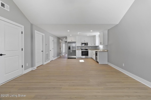 kitchen featuring light countertops, visible vents, appliances with stainless steel finishes, light wood-style floors, and white cabinetry