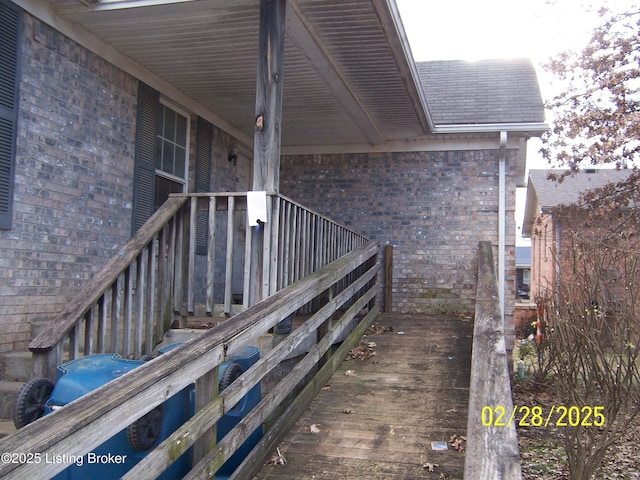 property entrance with brick siding