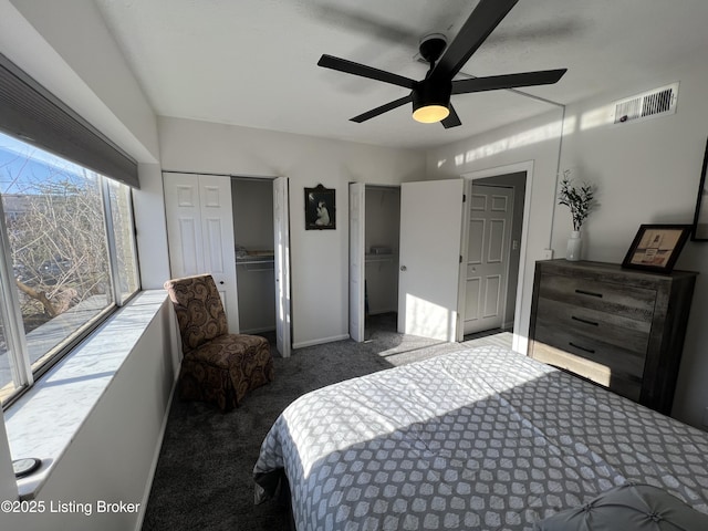 carpeted bedroom featuring access to outside, visible vents, ceiling fan, and baseboards