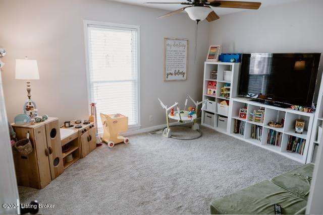 playroom with plenty of natural light, ceiling fan, carpet, and baseboards