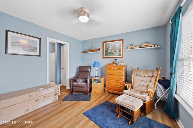 sitting room featuring wood finished floors