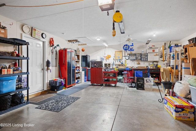 garage with a garage door opener, ceiling fan, and a workshop area