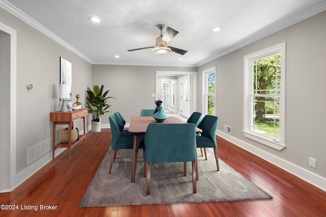 dining area featuring hardwood / wood-style flooring, recessed lighting, visible vents, baseboards, and ornamental molding