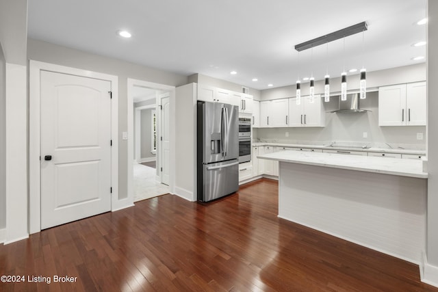 kitchen with appliances with stainless steel finishes, dark wood-style flooring, white cabinets, and light stone counters