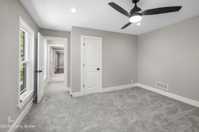 unfurnished bedroom with carpet floors, recessed lighting, visible vents, and baseboards