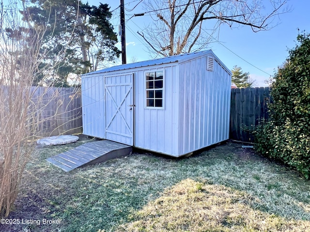 view of shed with a fenced backyard