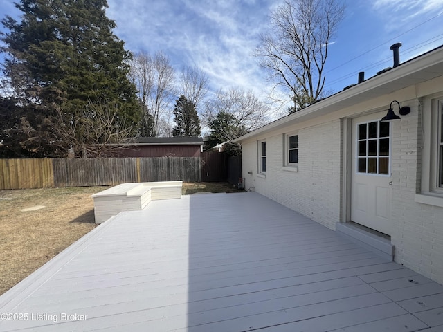 deck with a fenced backyard