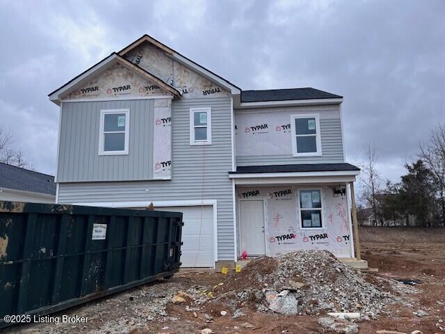 property in mid-construction with fence and an attached garage