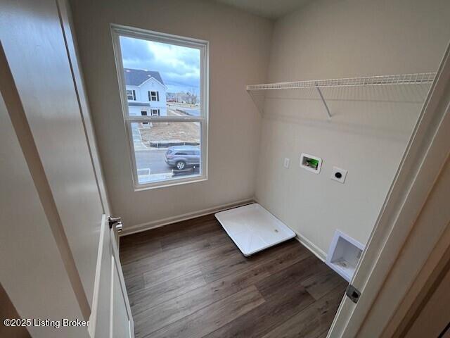 washroom with dark wood-style floors, washer hookup, electric dryer hookup, laundry area, and baseboards