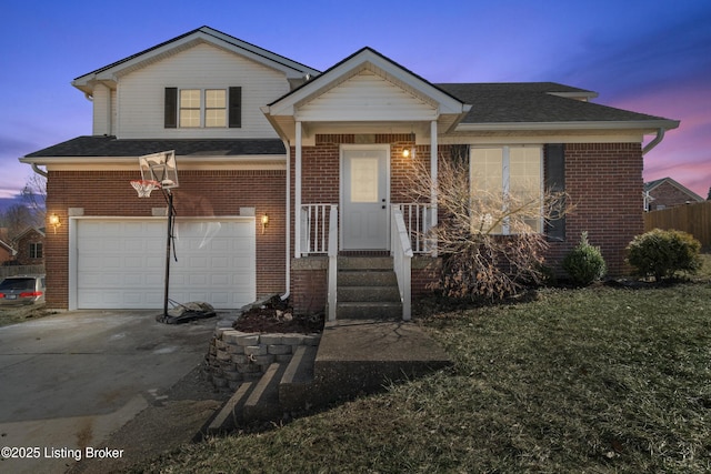 view of front facade with an attached garage, roof with shingles, concrete driveway, and brick siding